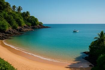 Candolim cove entry with sand arc and gentle teal water