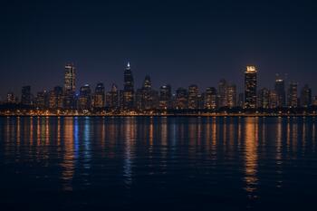 Mumbai night skyline reflecting on harbor water