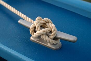 Line tied with a clean cleat hitch on aluminum cleat