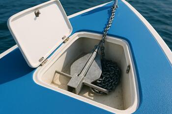 Bow anchor locker neatly coiled with rode and chain