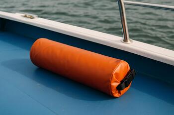 Dry tube with phones and keys clipped to a D-ring